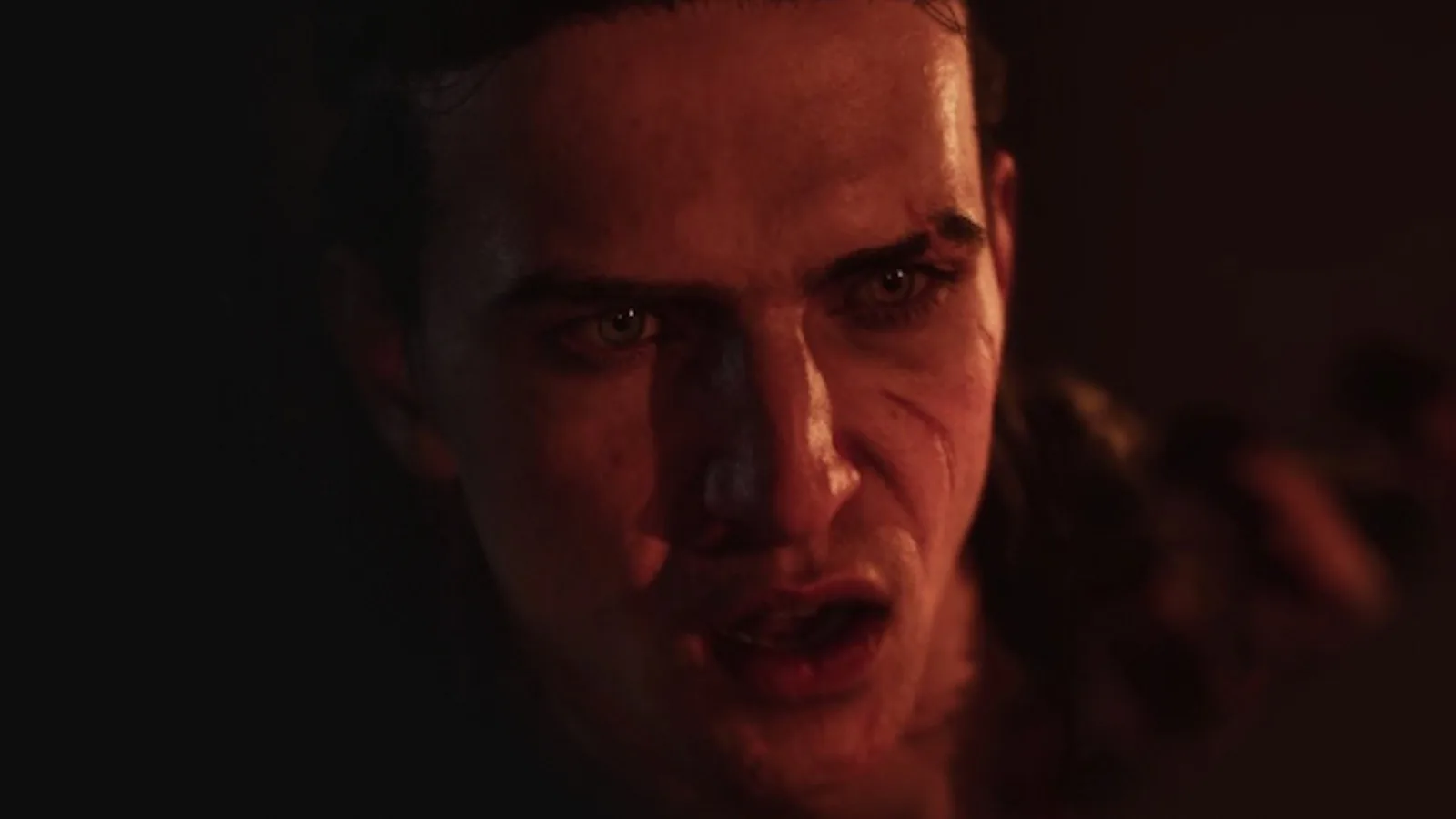 Coen appears in a close-up from the official game trailer